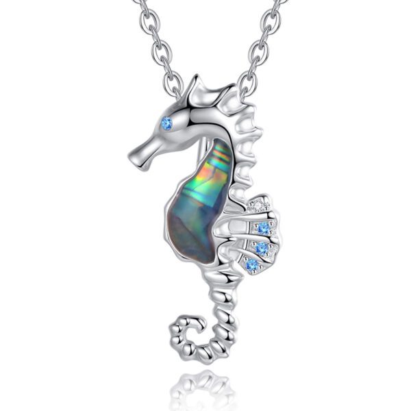 A silver necklace with an ocean themed piece of jewelry.