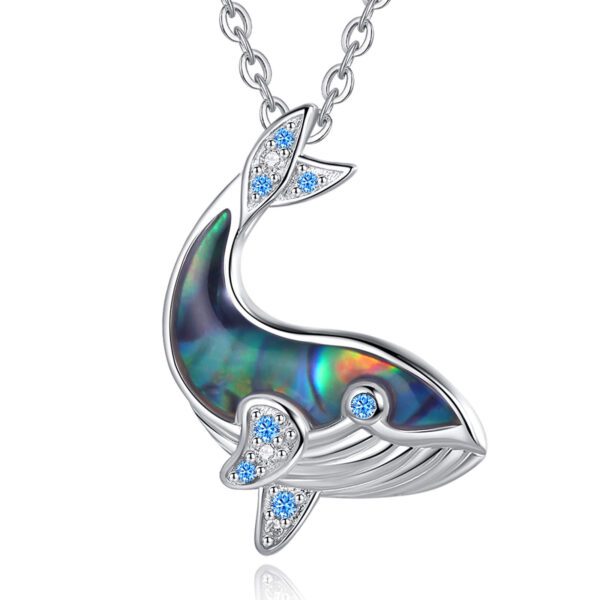 A whale shaped necklace with blue and white accents.