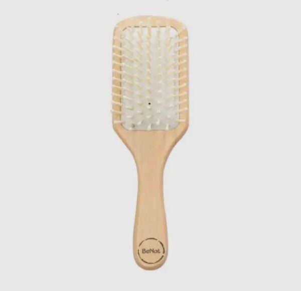 A wooden paddle brush with white bristles.