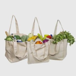 Three bags of food are lined up on a table.