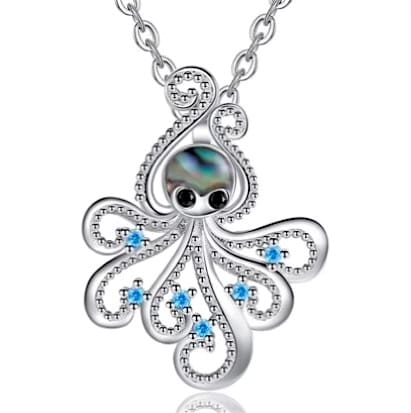 A silver octopus necklace with blue eyes and an abalone shell.