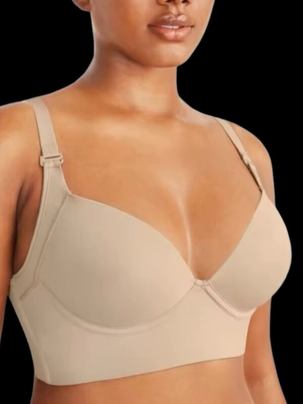 A woman wearing a bra with straps on top of it.