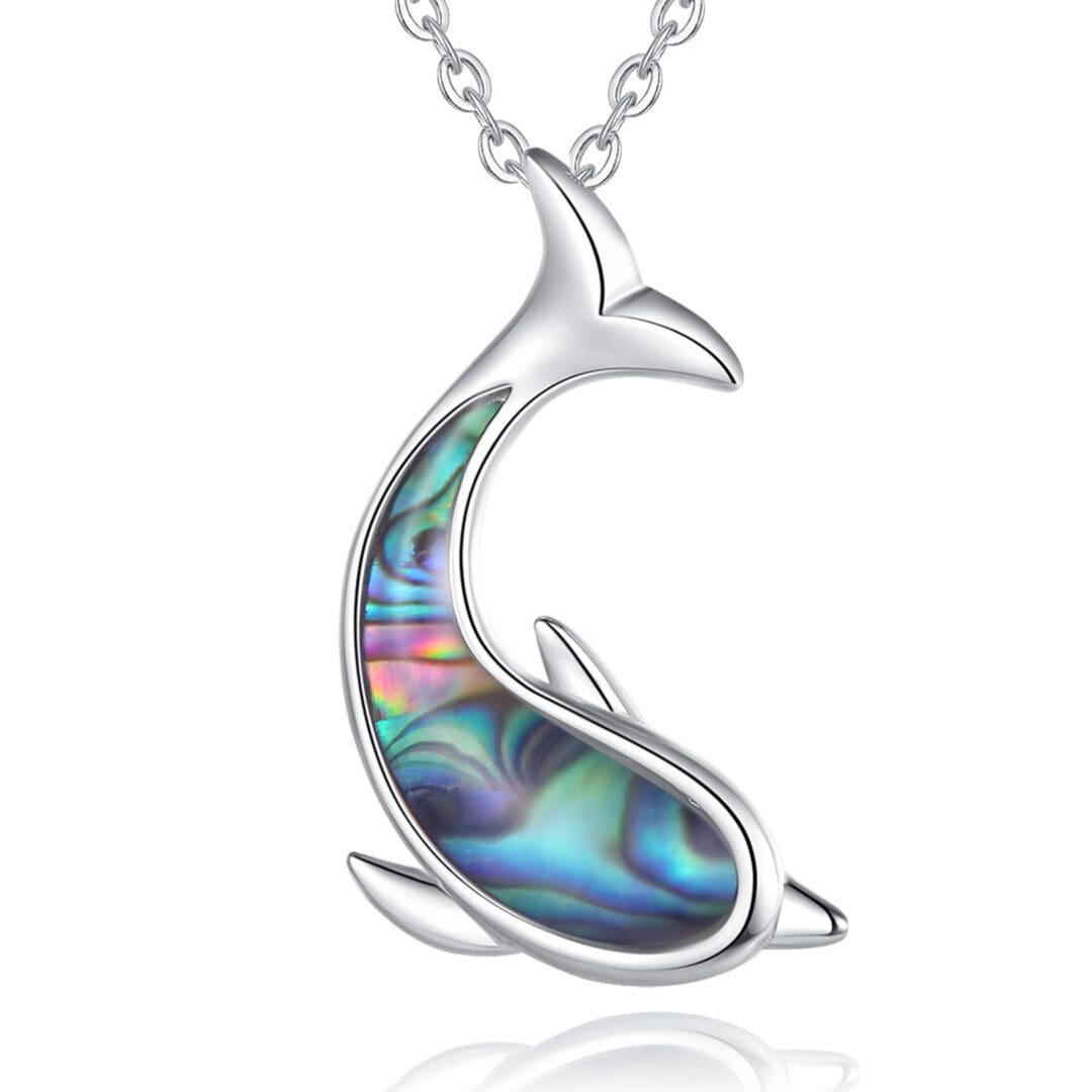 A dolphin shaped necklace with colorful shell inlay.