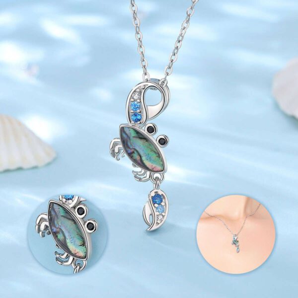 A necklace with an ocean themed pendant on it.