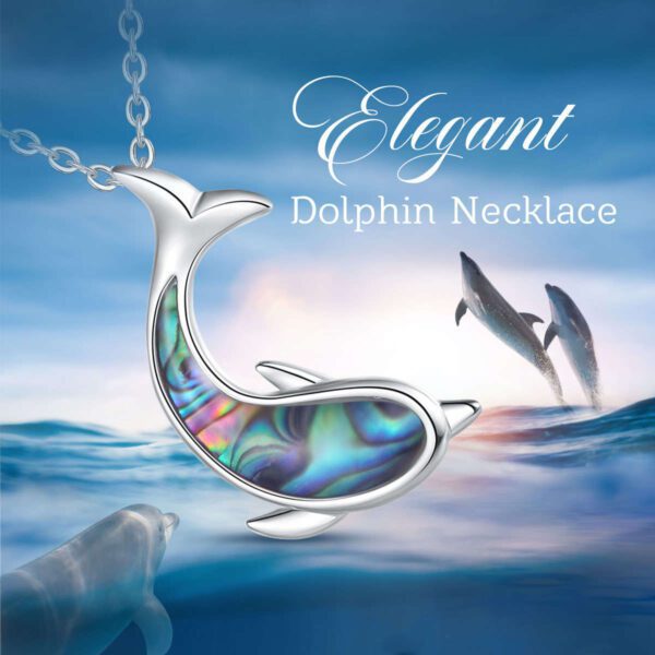 A dolphin necklace with a blue and white background