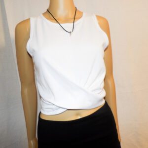 A mannequin wearing a white top and black skirt.