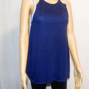 A woman wearing a blue tank top and black pants.