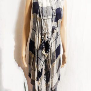 A mannequin wearing a dress with black and white checkered pattern.