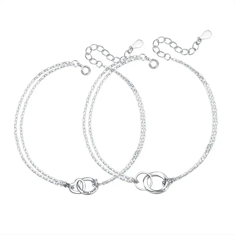 A pair of silver bracelets with two different chains.