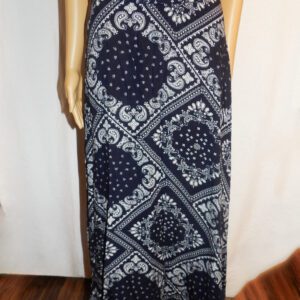 A woman wearing a long skirt with a pattern on it.