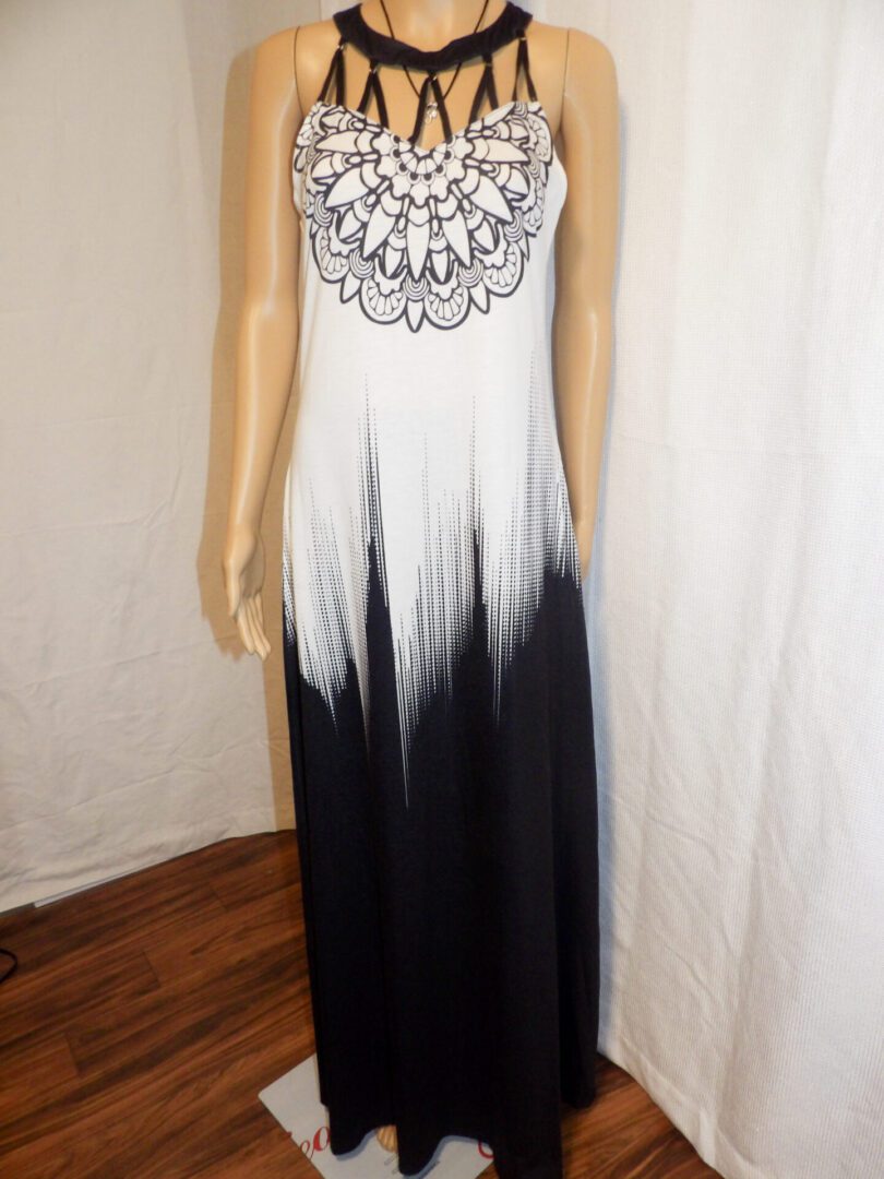 A black and white dress with a lace design on the front.