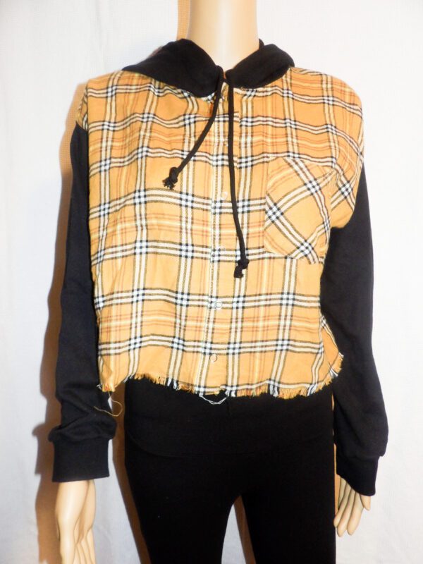 A yellow and black plaid shirt with a black top.