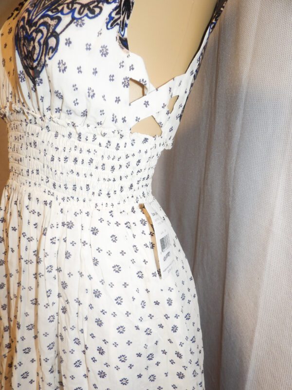 A white dress with black and white designs on it