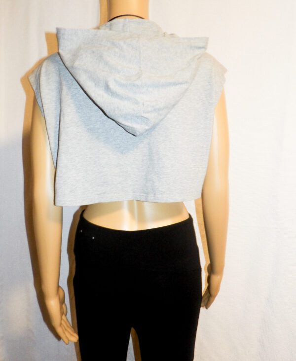 A mannequin wearing a black skirt and white top.