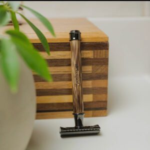 A wooden razor sitting on top of a counter.