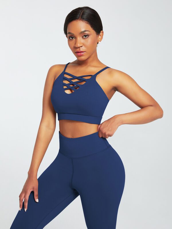 A woman in blue sports bra and leggings