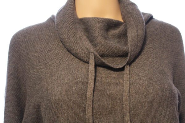 A close up of the neck and collar on a sweater.