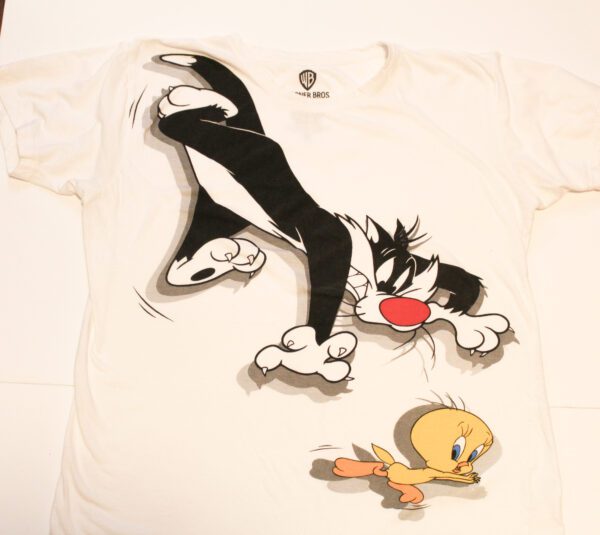 A white t-shirt with a cartoon of sylvester the cat and tweety bird.