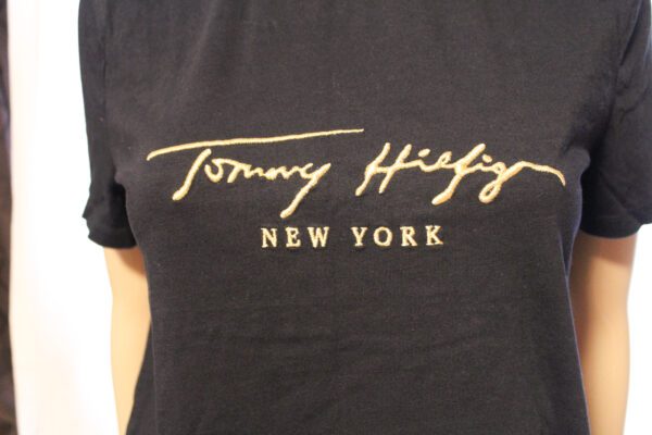 A close up of the tommy hilfiger logo on a t-shirt