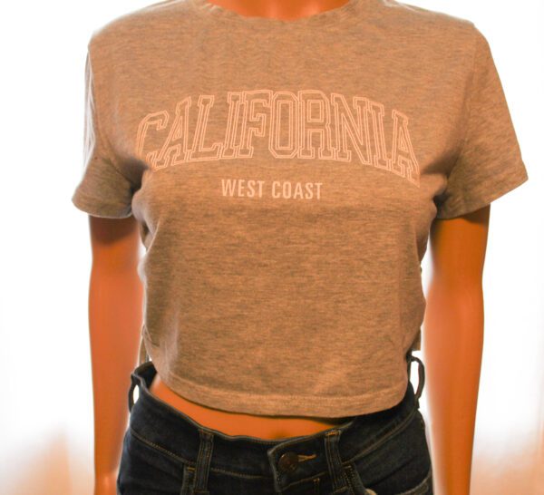 A woman wearing a gray t-shirt with california on it.