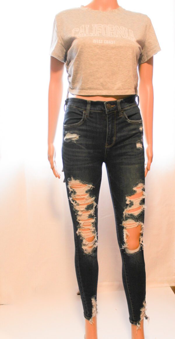 A mannequin wearing jeans and a t-shirt.