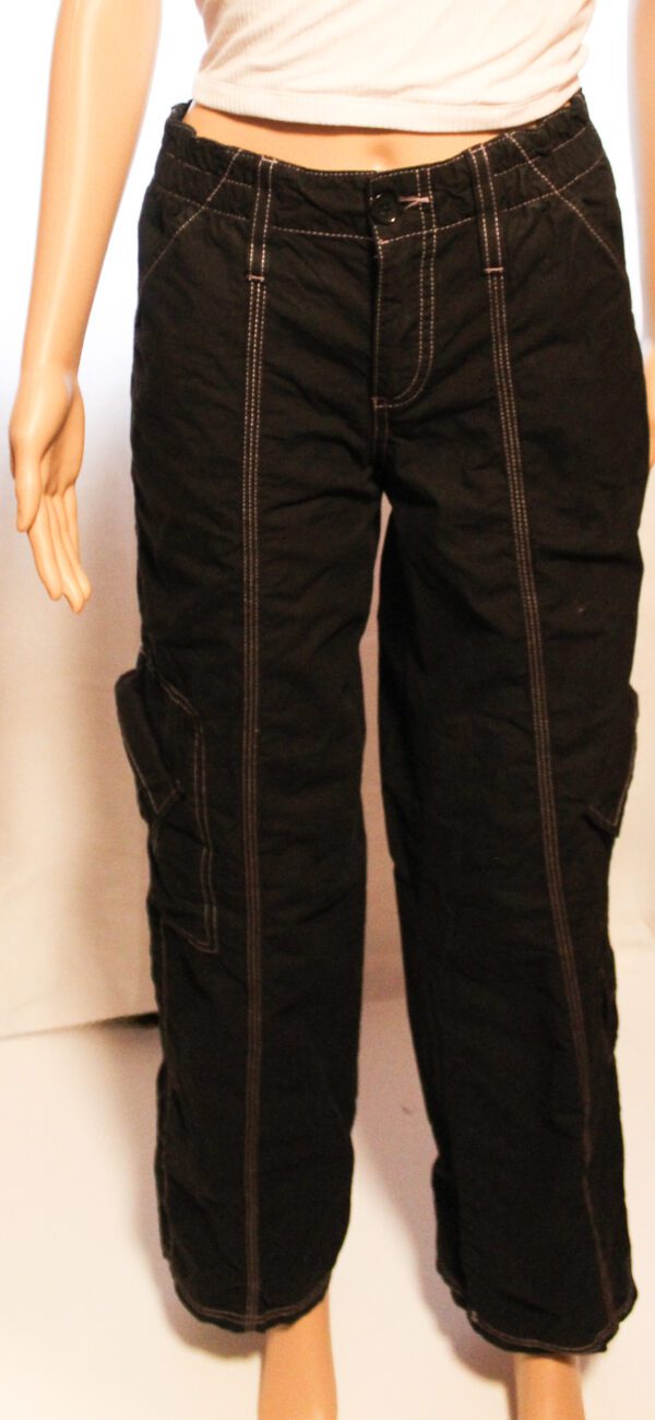 A pair of black pants with brown trim.