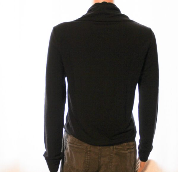 A man wearing black sweater and brown pants.