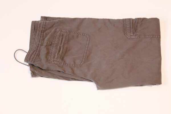 A pair of brown pants sitting on top of a table.