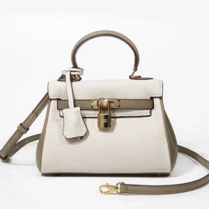 A white and green handbag with a strap.