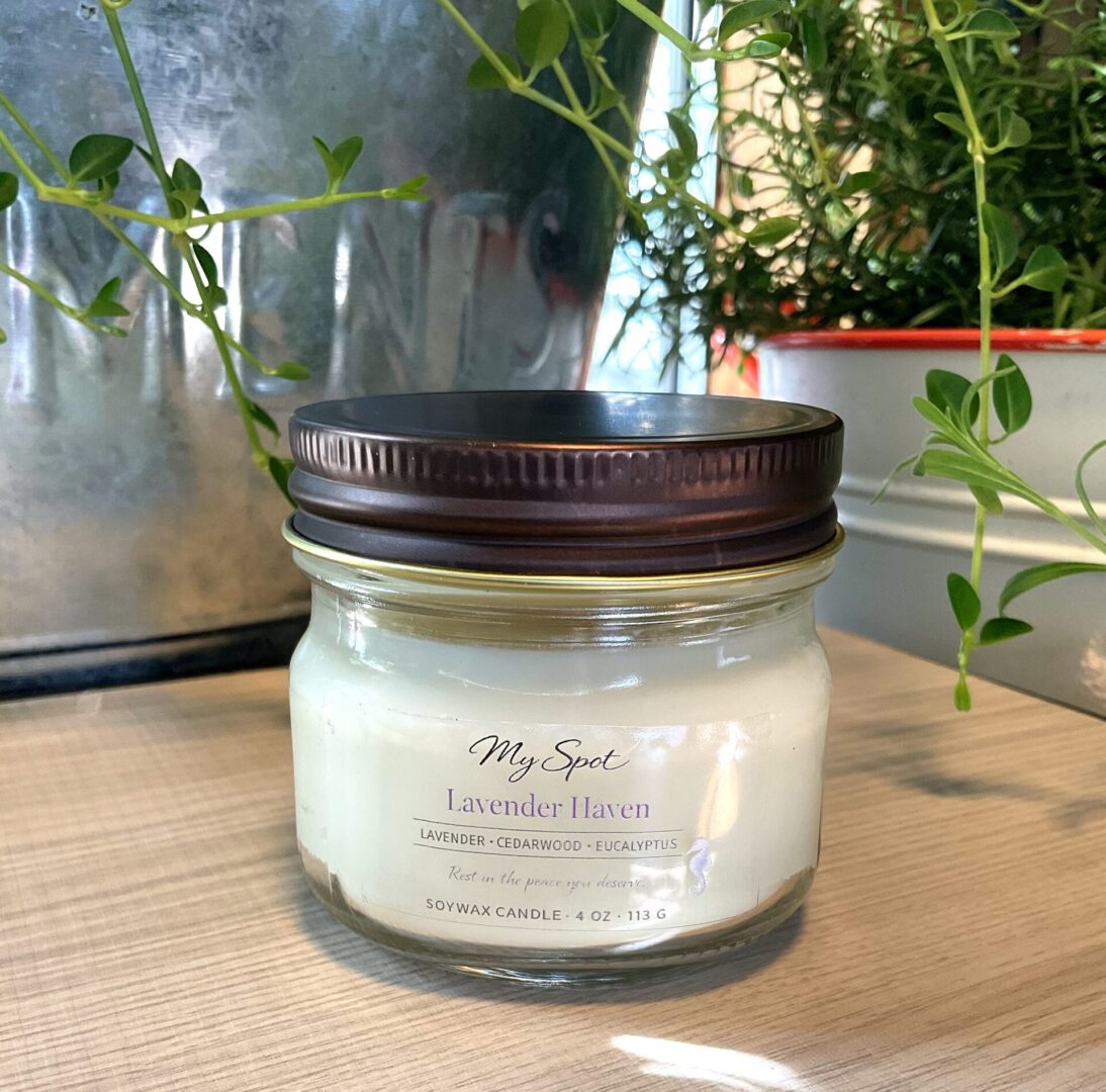 Lavender Haven handmade candle with natural plants background