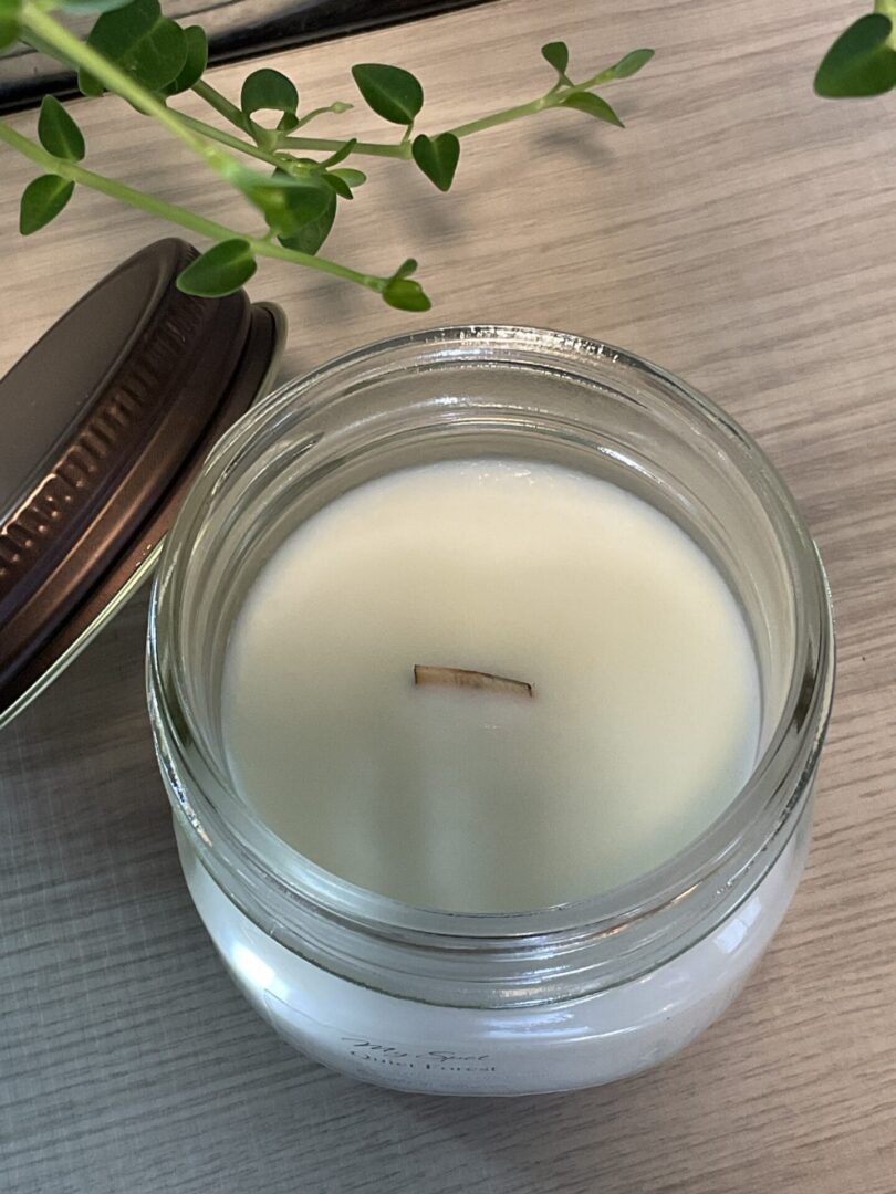 Top view of Ocean Moss soy candle with natural wood wick