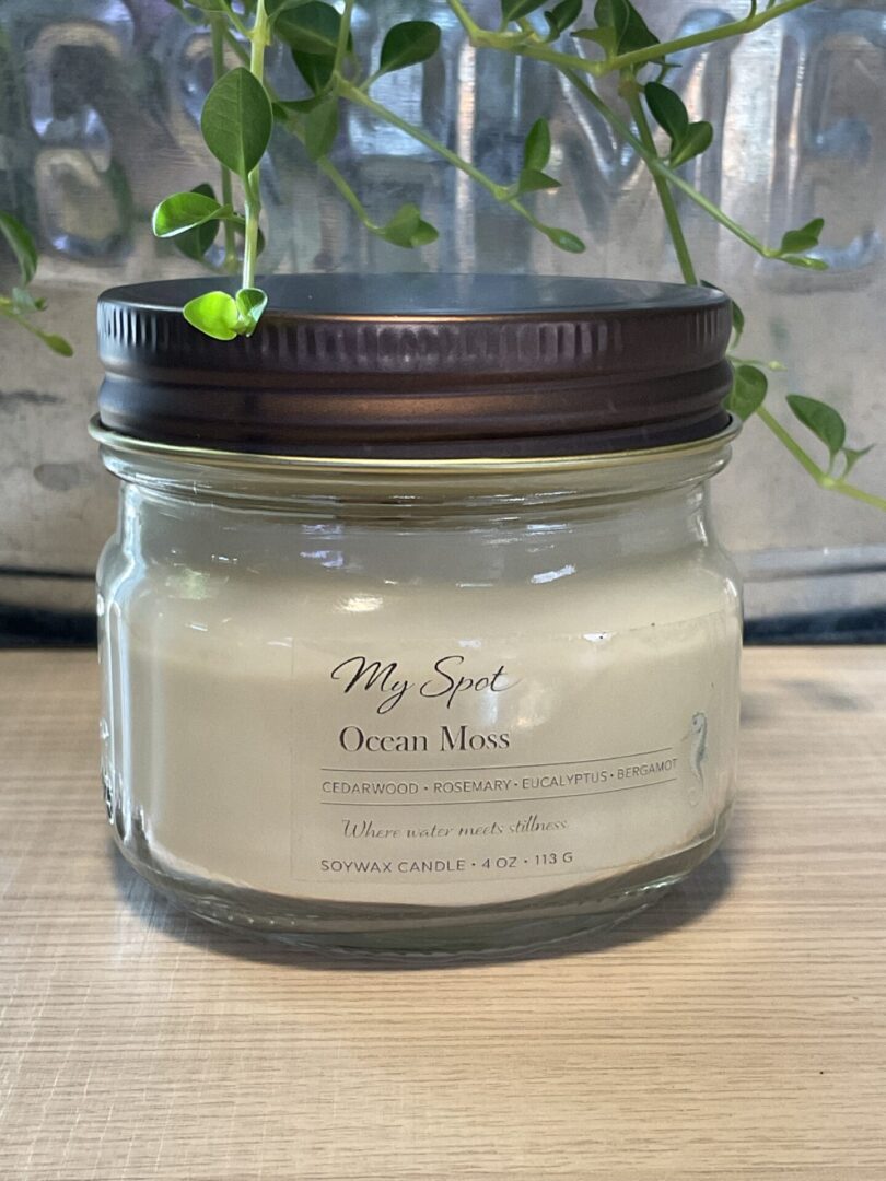 Ocean Moss soy candle in clear glass jar with wood wick, minimalist label